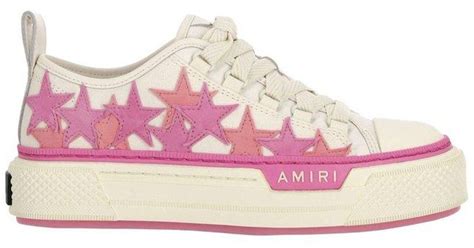 women pink amiri sneakers.